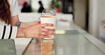 Coffee shop, counter and hands of women customer with drink, order or retail sale service. Small business, cafe and friends with smoothie, milkshake or espresso from server for local market support