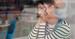 Cafe, conversation and funny woman talking by window at coffee shop, having fun and communication. Laughing, chat and person at restaurant cafeteria with comedy story, smile and social discussion