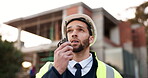 Engineer man, construction and radio for communication and project management at house. Architect, building contractor or person talking for safety check, inspection or maintenance on walkie talkie