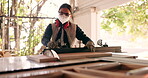 Wood, tools and saw with woman in workshop for furniture, manufacturing and renovation. Production, carpenter and design with person and equipment in home garage for remodeling, board and handyman
