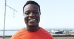 African runner man, face and smile outdoor for wellness, health and exercise in summer sunshine by harbor. Young guy, happy and free for workout, fitness and training by port with portrait by ocean