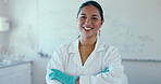 Smile, arms crossed and a woman science teacher in a classroom for education, research or innovation. Portrait, confident and a university or college professor in class for learning and development