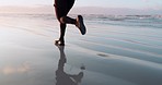 Fitness, sea or legs running on sand in cardio workout or exercise with speed training in Miami. Footwear, fast runner or closeup of sports athlete sprinting or jogging at sunset in nature or beach 