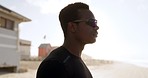 Face, sunglasses and a sports black man on the beach for fitness, training or a cardio workout by the ocean. Exercise, flare and health with a confident young runner at the sea for wellness on mockup