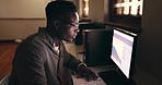 Night, business or black man with internet, computer or investment with stock market, budget planning or screen. African person, investor or accountant with a deadline, dark or trading in a workplace