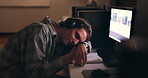 Desk, sleeping student and man on headphones, tired or stress at night on computer. Fatigue, bored or person rest on table, burnout and exhausted in learning, education or study in university college