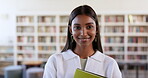 Books, education and library with face of woman on campus for research, studying or learning. Smile, future and scholarship with portrait of student at school for knowledge, college or university