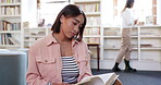 College, books and education with woman in library for relax, learning and research. Knowledge, university and student with person reading at school for information, studying and academic project 