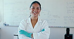 Smile, arms crossed and a woman science professor in a classroom for education, research or innovation. Portrait, confident and a university or college teacher in class for learning and development