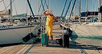 Woman, yacht and suitcase at port, travel and stress with fail, mistake and angry on vacation in Monaco. Girl, luggage and walk by ship, boat and frustrated with bag for holiday by ocean in summer