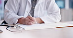Doctor, hands and writing prescription, results or diagnosis for consultation, notes or documents on desk at hospital. Closeup of medical or healthcare employee in report, paperwork or life insurance