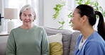 Retirement consultation, senior woman and healthcare nurse in nursing home for medical wellness and hospital support on sofa. Doctor, patient and caregiver with happiness and conversation on couch