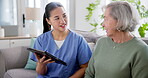 Tablet, help and nurse with old woman on sofa for consulting, medical and communication. Healthcare, retirement and support with caregiver and patient in nursing home for insurance and advice