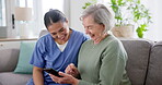 Relax, phone and online with old woman and nurse on sofa for social media, communication and website. Healthcare, retirement and support with caregiver and patient in nursing home for contact