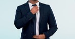 Fashion, suit and tie with a business man getting ready closeup in studio on a white background. Corporate, confidence and style with a professional manager or employee dressing for the start of work