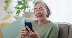 Senior woman, sofa and video call on smartphone, social network and mobile contact at home. Happy elderly lady talking on cellphone with voip communication, digital app or virtual chat in living room