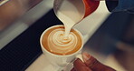 Coffee, milk and hands of person in cafe for beverage, breakfast and espresso. Liquid, cream and cappuccino with closeup of barista and latte art in restaurant for caffeine, waiter and food industry