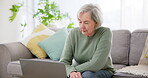 Laptop, senior woman and planning on couch for life insurance and retirement policy in living room of home. Old person, computer and documents for financial budget, house payment and tax investment