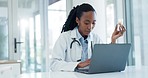 Doctor, laptop and black woman research pills for online medical info, hospital report or medicine review. Clinic, computer and African surgeon typing pharmaceutical search for healthcare service