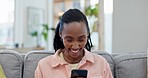 Black woman, living room and laughing from phone text on social media with funny meme on a home sofa. African female person, couch and mobile web app with a smile online and message in a lounge
