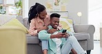 Home, relax and black couple with a smartphone, funny or connection with network, social media or mobile user. African people, man or woman in a lounge, cellphone or digital app with meme or laughing