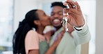 Hands, couple and keys in new home for moving, real estate investment and security for future. Closeup, black people and kiss to celebrate in house, property building and finance for mortgage loan