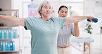 Senior woman, physiotherapist and muscle exercise or stretching support in physical therapy or healthcare consultation. Physiotherapy, elderly patient and orthopedic nurse help with dumbbell fitness