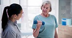 Physiotherapist, healthcare and old woman with dumbbells, support and muscle rehabilitation with recovery. Senior person, chiropractor or elderly lady with wellness, healing or consultation with help