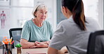 Talking, senior and a woman with a doctor for a consultation, healthcare and advice in an office. Medicine, planning and an elderly person or patient with a medical employee with feedback or notes