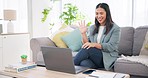 Business woman, video call and home in virtual job interview for hiring, recruitment or remote work opportunity. Asian worker wave hello in online meeting, laptop or communication on living room sofa