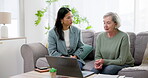 Senior, woman and finance with conversation and laptop for life insurance, mortgage loan or retirement investment on sofa in home. Accounting, people and financial budget for asset management or tax