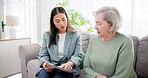 Finance, woman and senior with discussion on documents for life insurance, mortgage loan or retirement investment on sofa in home. Accounting, people and financial budget for asset management or tax