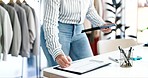 Woman, hands and tablet for checklist in clothing store, boutique or writing inventory on clipboard. Closeup of female person or small business owner with technology in schedule planning or orders