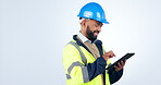 Construction worker, man and tablet for project management, design review and engineering software in studio. Contractor or builder on digital technology for architecture update on a white background