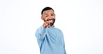 Young man, studio and point at you with smile on face for decision, agreement or yes by white background. Student guy, recruitment and choice for hiring, welcome or onboarding to university course