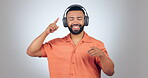 Man, dancing and headphones with music and energy, fun and happy with disco or techno isolated on white background. Listening to audio, radio and subscription with streaming and dancer in studio