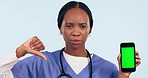 Phone, green screen and doctor thumbs down for healthcare mistake, bad results and nope in studio. Face of African woman or nurse with medical problem, mobile and tracking marker on white background