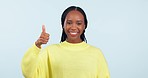 Black woman, thumbs up and down in decision, choice or approval against a studio background. Portrait of African female person with like emoji, yes or no sign in OK, disapproval or question on mockup