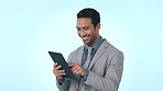 Happy businessman, tablet and research in social media, communication or networking against a studio background. Asian man or employee on technology app for business or online search on mockup space