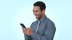 Happy businessman, phone and typing in social media, communication or networking against a studio background. Asian man or employee smile for online chat or texting on mobile smartphone app on mockup