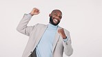 Winner, success and bonus with a business man in studio on a white background for celebration. Portrait, smile or motivation and a happy employee cheering with energy for the goal of promotion