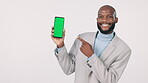Phone, black man and hands point to green screen for marketing and advertising in studio and mockup space. Professional person, smartphone and tracking marker for display and product placement in app