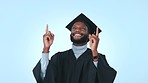 Pointing, celebration and a black man for graduation on a studio background for school achievement. Excited, success and an African graduate happy about education goals, target or diploma win