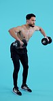 Workout, gym and man with dumbbell for fitness, training and exercise with healthy mindset and body. Personal trainer, person and athlete on blue background for wellness, muscle and cardio in studio