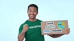 Motivation, poster for recycling and volunteer man on blue background in studio to promote conservation on earth day. Portrait, smile and support for global warming, climate change or sustainability