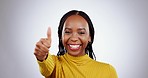 Black woman, thumbs up and agreement with support and yes, mockup space and face isolated on white background. Portrait, hand gesture and like emoji with pride, happy with vote or feedback in studio