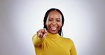 Happy, face and black woman with hand pointing studio for you, choice and vote selection on grey background. Smile, portrait and African lady model with finger decision emoji, offer or opportunity