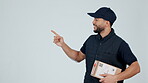 Delivery man, pointing at supplier list and box, OK with service information and advertising on white background. Package, supply chain and e commerce with courier choice and distribution in studio