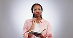 Happy woman, notebook and thinking of ideas, excited for solution or study goals on a white background. African student problem solving, writing and why face, wow emoji and learning results in studio