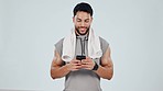 Fitness, phone and man in studio laugh after exercise, training and workout for wellness. Sports, happy and person on smartphone online for social media, funny chat and mobile app on gray background